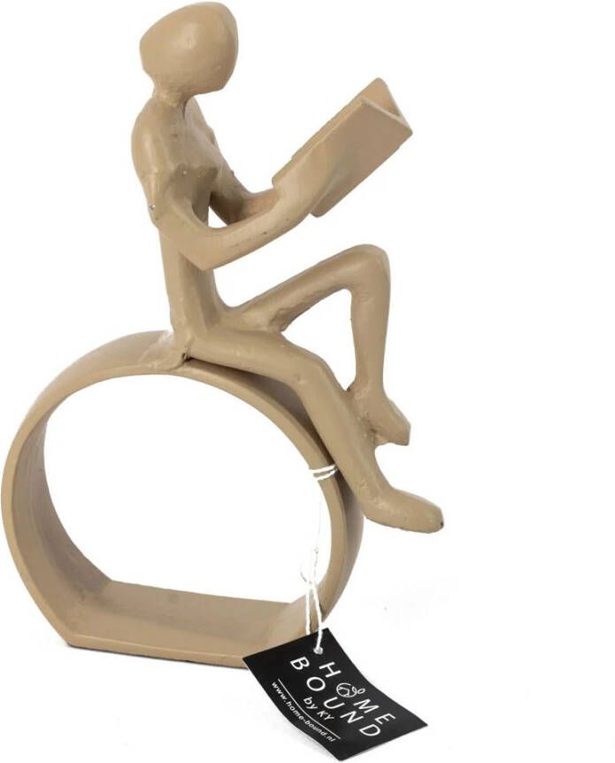 Beeld boek zittend beige