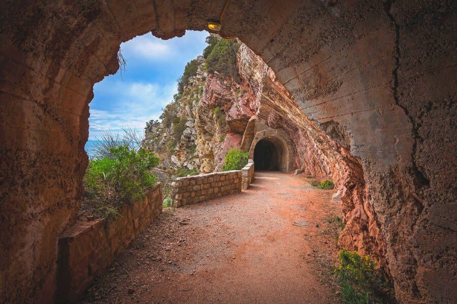 Papermoon Fotobehang Tunnel in de berg Petrovac Bay Vliesbehang eersteklas digitale print