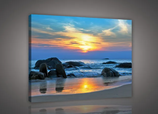 Canvas Schilderij - Landschap - Zee - Oceaan - Rotsen - Zonsondergang - Wolken - Horizon - Strand - Inclusief Frame - 100x75cm (lxb) Meerdere kleuren
