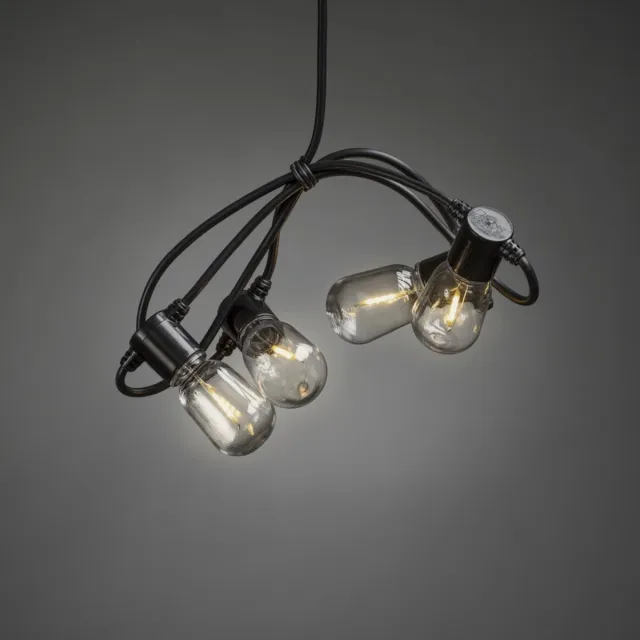 Konstsmide Sweden ® 2386-800 - Snoerverlichting - Premium 20 lamps LED feestverlichting ** new version 2021** - 4 traps dimmer - extra warmwit - 4.75m verlichte lengte – spacing 25cm – aansluitsnoer 10m - 6V buitentrafo - voor buiten of binnen