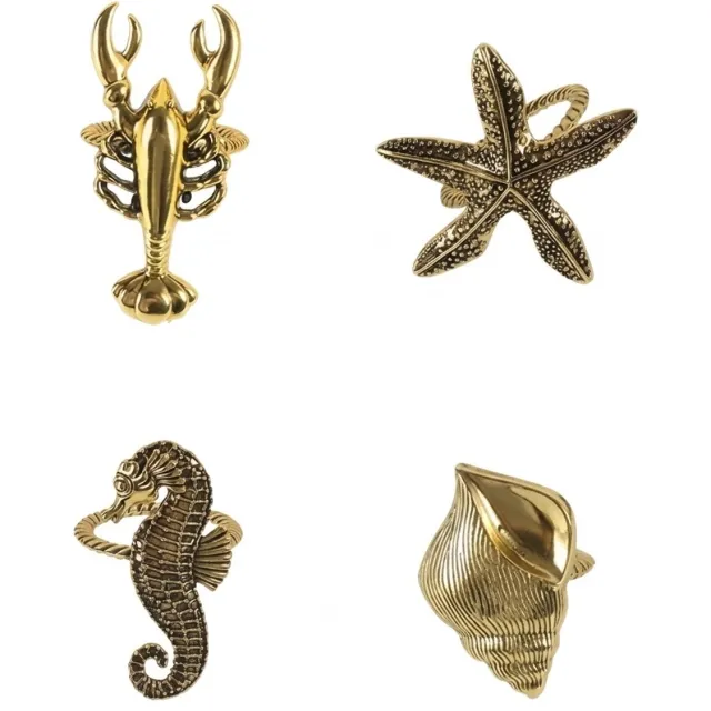 NUVEX Goudkleurige servetringen set van 4 – metalen servethouder ringen met zeepaardje zeester kreeft en schelp – decoratieve servet ringen met oceaan thema en reliëf – tafeldecoratie voor diner feest en bruiloft