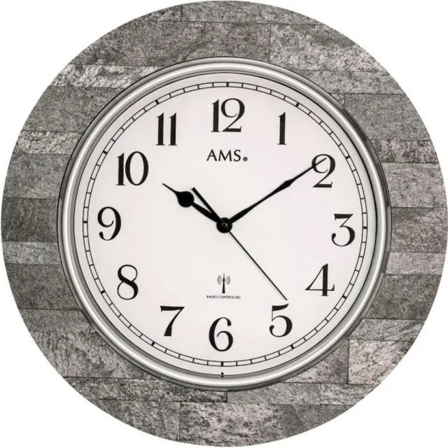 AMS De AMS F5570 is een hoogwaardige draadloze wandklok met een diameter van 50 cm en een diepte van 5 cm. De ronde houten kast in antraciet geeft de wandklok een nobele, tijdloze uitstraling Grijs