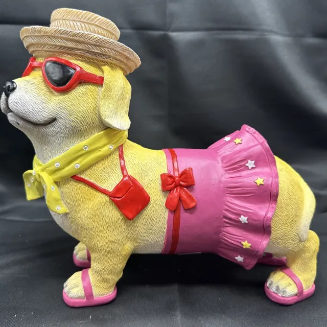 Impuls Decoratief polyresin beeld ''Tropische hond met roze rok "- meerkleurig - hoogte 20 x 25 x 4 cm - Woonaccessoires - Tuinaccessoires - Decoratieve beelden Meerkleurig - roze rok